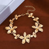 Wholesale Women's Alloy Goldplated Flower Stitching Bracelet Jewelry