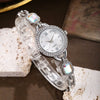 Wholesale Women's Alloy Leisure Watch With Colorful Gemstones And Round Dial And Gold Horseshoe Buckle