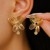 Wholesale Women's Animal Style Alloy Electroplated Hollow Spiral Butterfly Stud Earrings