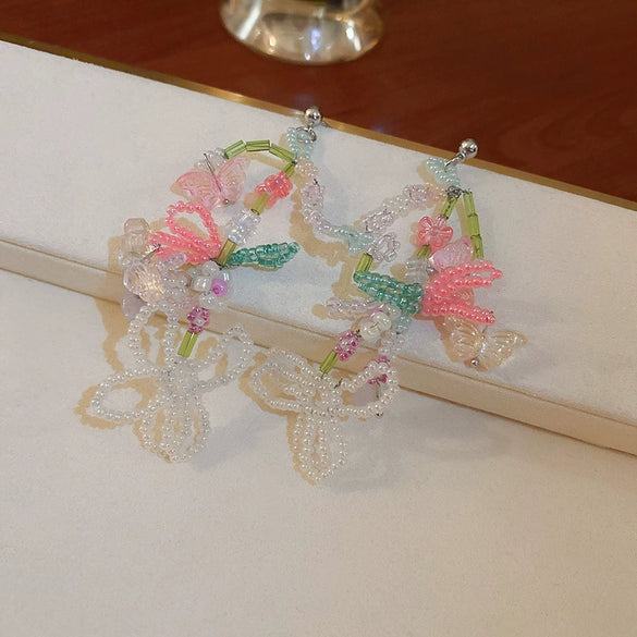 Wholesale Women's Artificial Crystal Butterfly Earrings With Real Gold Electroplated Silver Needles And Inlaid Pearls