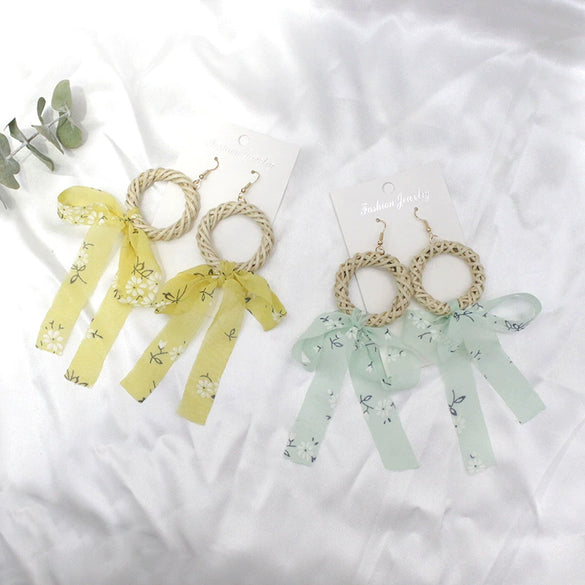 Wholesale Women's Bohemian Style Silk Straw Earrings With Doll Pattern And Ribbon Tassel