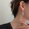 Wholesale Women's Brass Heart Shaped Asymmetric Bear Love Earrings Light Luxury Cold Style