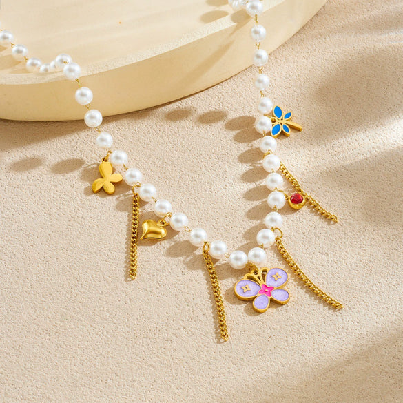 Wholesale Women's Casual Stainless Steel Electroplated Heart Shape Insect Pattern Pearl Strand Beaded Chain Necklace With Imitation Pearl Tassel Pendant
