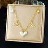 Wholesale Women's Chic Style Gold Electroplated Hollow Heart Shape Pearl Pendant Stainless Steel Necklace With Flat Cross Chain
