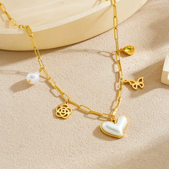 Wholesale Women's Chic Style Gold Electroplated Hollow Heart Shape Pearl Pendant Stainless Steel Necklace With Flat Cross Chain