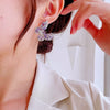 Wholesale Women's Copper Earrings With Bow Pattern And Zircon Treatment In Simple And Animal Style