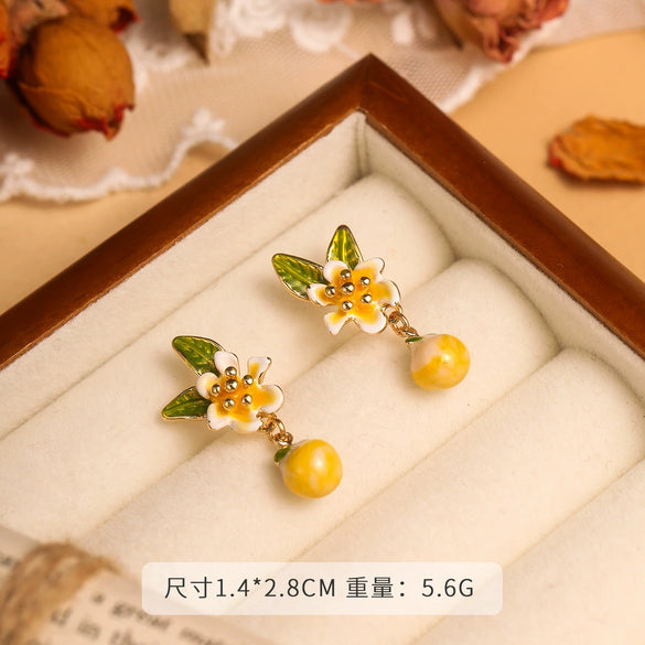Wholesale Women's Copper Enamel Flower Dripping Oil Earrings Light Luxury Style