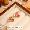 Wholesale Women's Copper Enamel Flower Dripping Oil Earrings Light Luxury Style