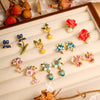 Wholesale Women's Copper Enamel Flower Dripping Oil Earrings Light Luxury Style