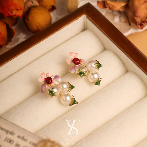 Wholesale Women's Copper Enamel Flower Dripping Oil Earrings Light Luxury Style