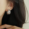 Wholesale Women's Copper Geometric Zircon Earrings With Metallic Strap And Niche Design