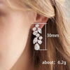 Wholesale Women's Copper Long Tassel Petal Earrings With Flower And Leaf Pattern
