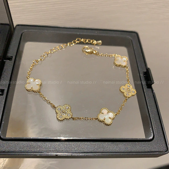 Wholesale Women's Copper Zircon Inlaid Fourpetal Flower Geometric Sweet Style Bracelet Real Gold Electroplated