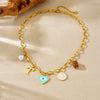 Wholesale Women's Creamy Sweet Style Heart Shape Cartoon Multielement Oil Dripping Love Eyes Letter Round Pendant Stainless Steel Electroplated Necklace With Flat Cross Chain