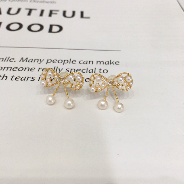 Wholesale Women's Cute Bow Natural Freshwater Pearl Earrings In 18K Gold Color Oblate Shape