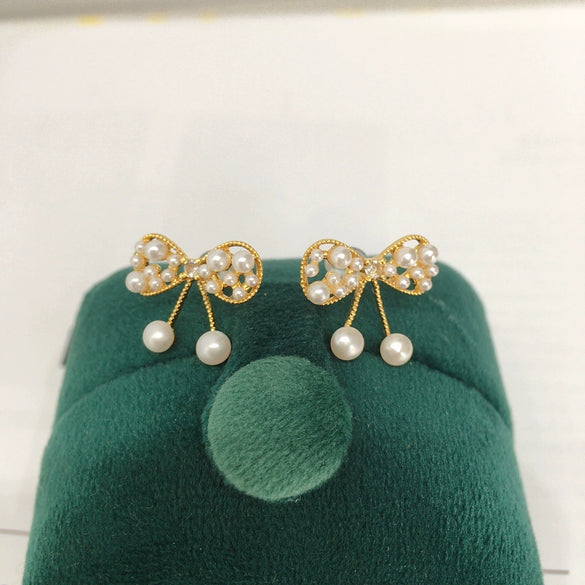 Wholesale Women's Cute Bow Natural Freshwater Pearl Earrings In 18K Gold Color Oblate Shape