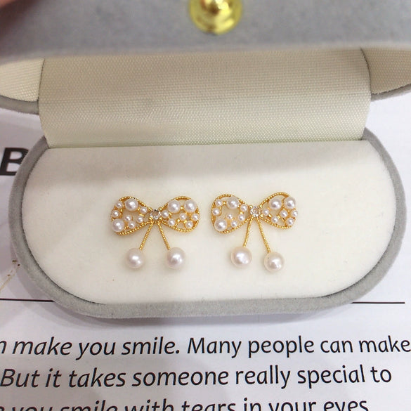 Wholesale Women's Cute Bow Natural Freshwater Pearl Earrings In 18K Gold Color Oblate Shape