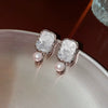 Wholesale Women's Diecast Silver Needle Blue Crystal Flower Pearl Earrings With Diamond Design And High Sense Style