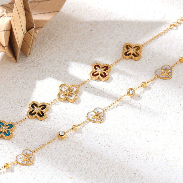 Wholesale Women's Electroplated Stainless Steel And Titanium Steel Bracelet With Flower Four Leaf Clover Heart Patterns