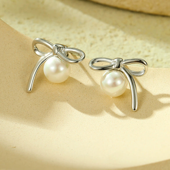 Wholesale Women's Elegant Bow Pearl Titanium Steel Electroplated Earrings Fashion Simple No Fading