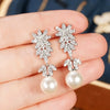 Wholesale Women's Elegant Geometric Plant Flowers Imitation Pearl Copper Electroplated Wedding Dress Earrings