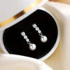 Wholesale Women's Elegant Geometric Round Imitation Pearl And Zircon Earrings Copper Jewelry
