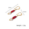 Wholesale Women's Exotic Geometric Natural Pearl Earrings With Sea Bamboo Red Tassel And Electroplated Ear Hooks