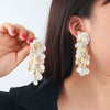 Wholesale Women's Fashion Geometric Plastic And Resin Handwoven Earrings With Multilayered Tassels