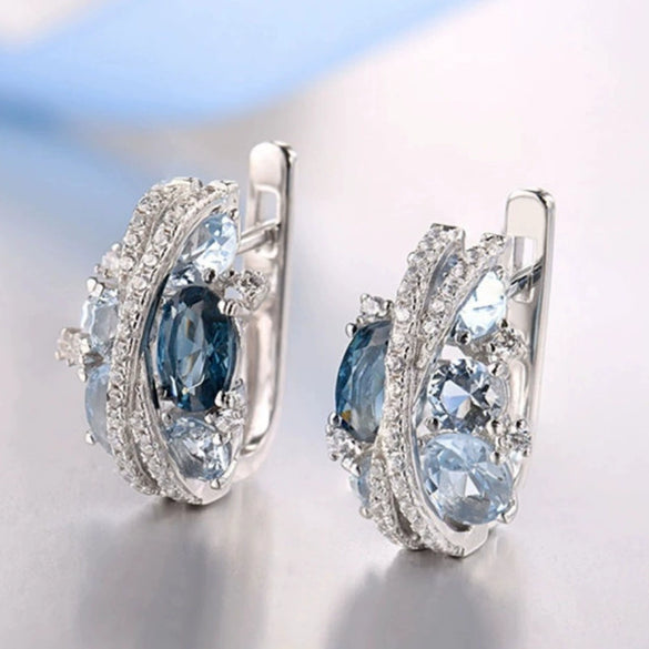 Wholesale Women's Fashion Jewelry Copper Zircon Xshaped Hollow Earrings With Flower Pattern