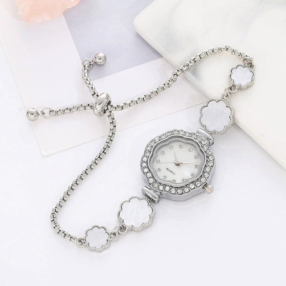 Wholesale Women's Fashion Quartz Watch With Diamond And Plum Blossom Diecast Case And Strap Titanium Clasp Flower Shaped Dial