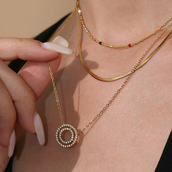 Wholesale Women's Fashion Stainless Steel Circle Pendant Clavicle Necklace And Bracelet Set With Electroplating Niche Design