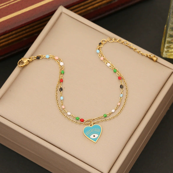 Wholesale Women's Fashion Stainless Steel Heart Shaped Double O Chain Necklace With Electroplating And Drop Oil Eyes Design