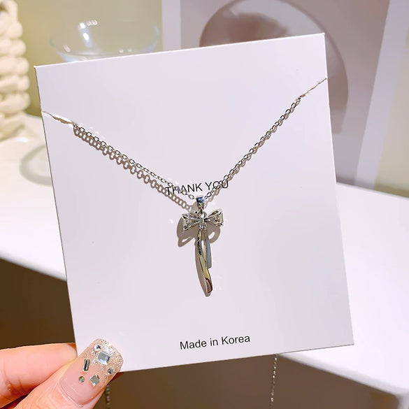 Wholesale Women's Fashionable Diamondset Bow Pendant Necklace In Titanium Steel And Copper With Cross Chain
