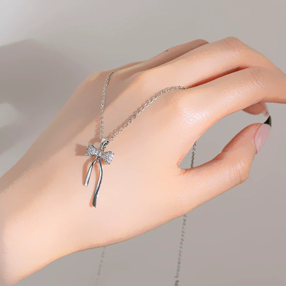 Wholesale Women's Fashionable Diamondset Bow Pendant Necklace In Titanium Steel And Copper With Cross Chain