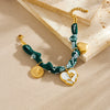 Wholesale Women's French Retro Heartshaped Printed Fabric Rope Chain Goldplated Stainless Steel Compass Pendant Bracelet