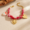 Wholesale Women's French Retro Printed Rope Chain Goldplated Cut Out Stainless Steel Heartshaped Flower Ceramic Pendant Bracelet