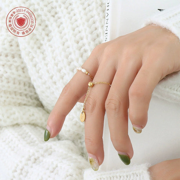 Wholesale Women's Freshwater Pearl Geometric Pull Buckle Finger Chain And Ring Made Of Titanium Steel With Electroplating