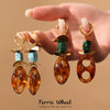 Wholesale Women's Geometric Ferris Wheel Oval Pig Nose Electroplated Stainless Steel Resin Turquoise Earrings