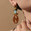 Wholesale Women's Geometric Ferris Wheel Oval Pig Nose Electroplated Stainless Steel Resin Turquoise Earrings