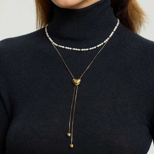 Wholesale Women's Geometric Gold Plated Stainless Steel Snake Bone Chain Heart Tassel Pullout Necklace