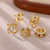 Wholesale Women's Geometric Hollow Flower Goldplated Inlaid With Gold Stainless Steel Zircon Ring With Fruit Shape And Pattern Light Luxury Style