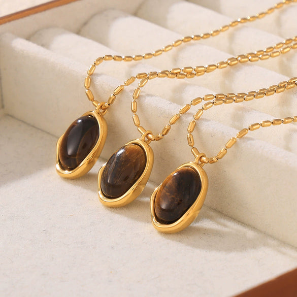Wholesale Women's Geometric Oval Inlaid Tiger Eye Pendant Necklace With 18K Gold Plated Titanium Steel