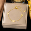 Wholesale Women's Geometric Stainless Steel Real Gold Plated Bracelet With Four Leaf Clover Pendant