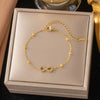 Wholesale Women's Geometric Stainless Steel Real Gold Plated Bracelet With Four Leaf Clover Pendant