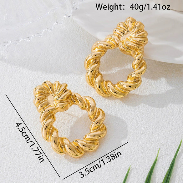 Wholesale Women's Geometric Twist Pattern Circle Alloy Earrings With Stainless Steel Ear Needles Electroplated