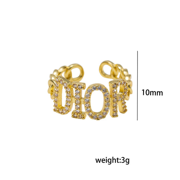 Wholesale Women's Gold Plated Copper Letter Ring With Diamond Encrusted And Hollow Design