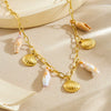 Wholesale Women's Goldplated Stainless Steel Heart Shape And Flower Pattern Hollow Pendant Necklace With Cross Chain