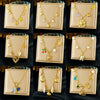Wholesale Women's Goldplated Stainless Steel Heart Shape And Flower Pattern Hollow Pendant Necklace With Cross Chain