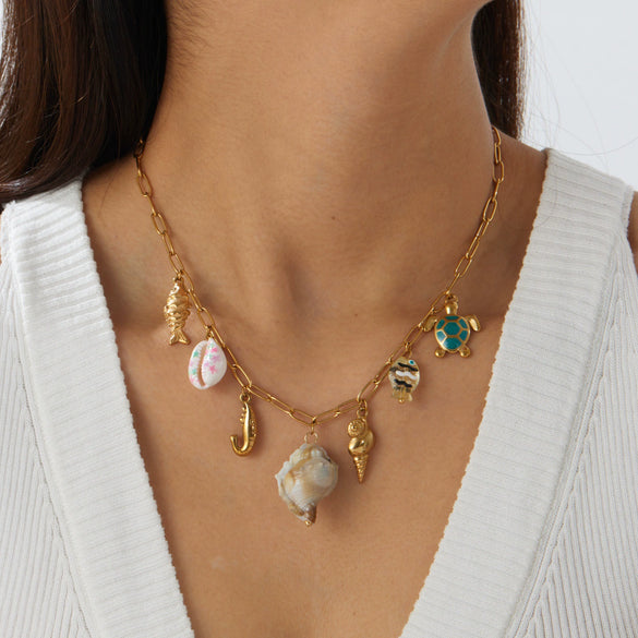 Wholesale Women's Goldplated Stainless Steel Marine Life Conch And Small Fish Pendant Necklace With Flat Cross Chain