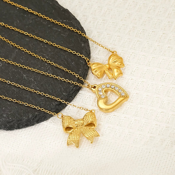 Wholesale Women's 18K Goldplated Heart Shape Bow Pendant Cross Chain Necklace Made Of Titanium Steel